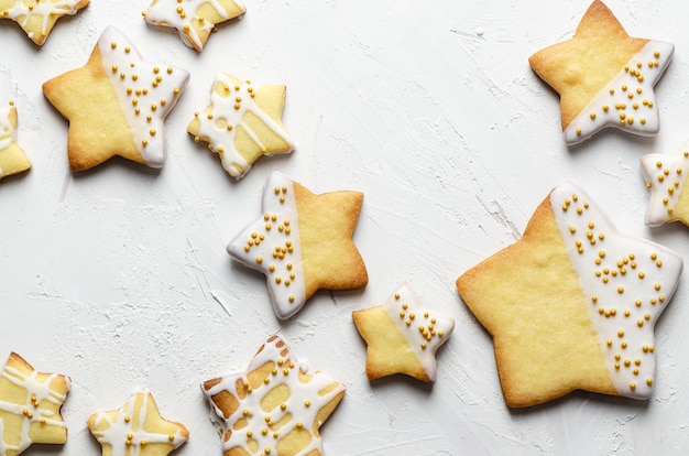 Star iced cookies with golden pearls