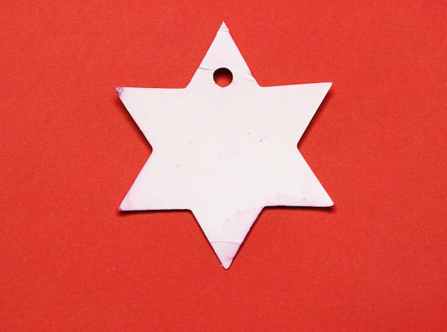 star paper on red paper background.