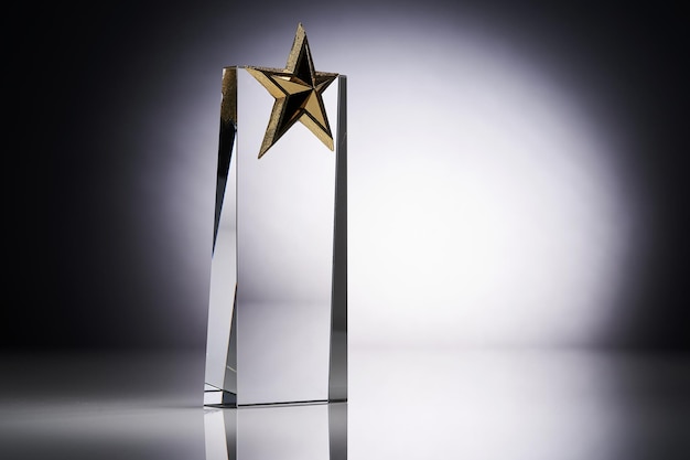 Star shape of crystal glass trophy against gray background