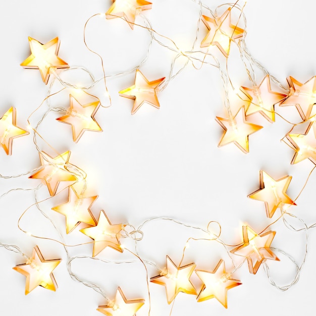 Star shaped Christmas lights frame. Flat lay, top view