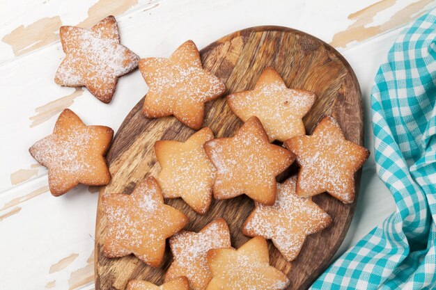 Star shaped cookies on wooden table. Top view