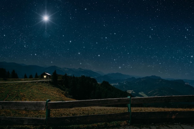 The star shines over the manger of christmas of jesus\
christ.