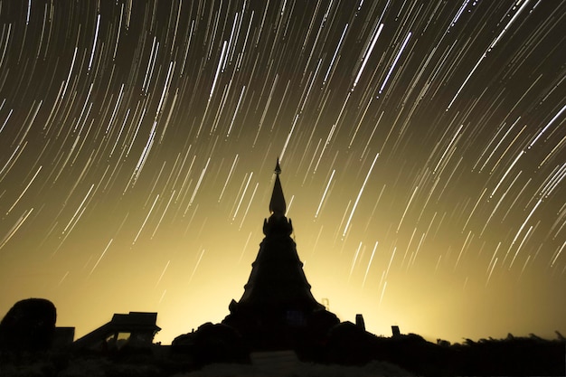 Star trails over the pagoda in chiangmai Thailand.