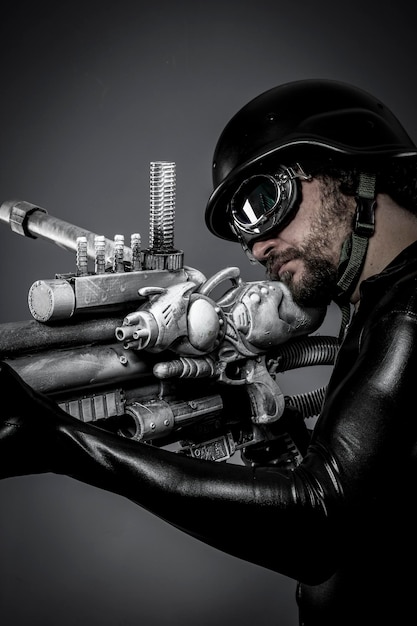 Starfighter with huge plasma rifle, fantasy concept, military helmet and goggles motorcyclist