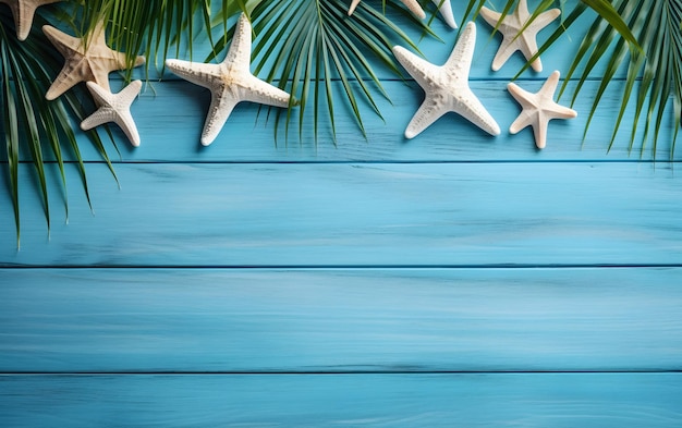 Starfish and palm leaves on blue wooden background Top view with copy space