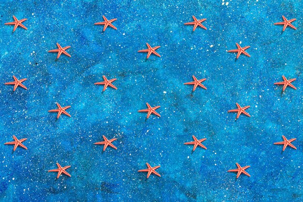 Foto modello di stelle marine sul blu nautico.