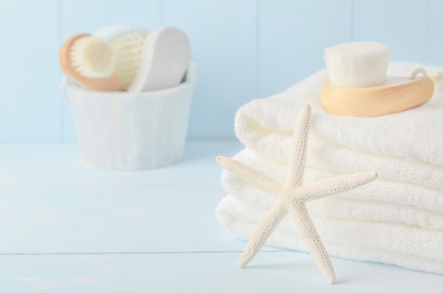 Starfish and white towels with Facial cleansing brush