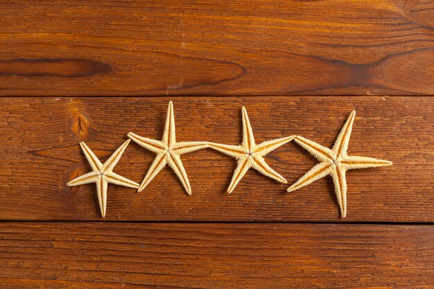 Starfish on wooden background