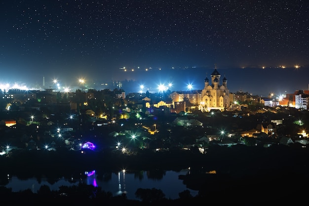 Starry night sky over the city.