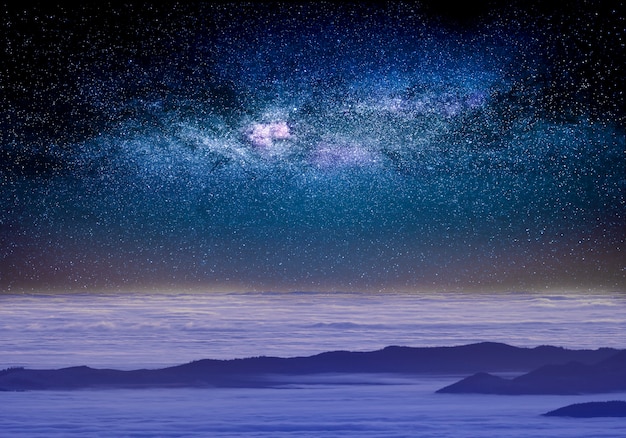 Starry sky above the clouds, mystical magical atmosphere.