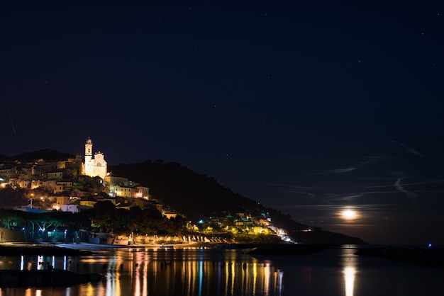 Starry sky and moonlight at glowing Cervo, Ligurian Riviera, Italy