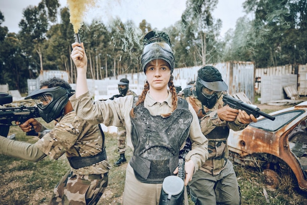 Start battle and girl with smoke during paintball military training and army game in Spain War alert and woman playing with gear and equipment during a competition sports and action on a field