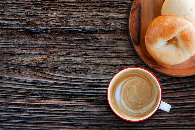 Start the day by fresh homemade bagel bread and hot coffee latte