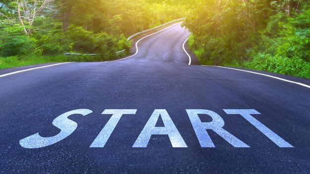 Start line on highway concept for business planning strategies and challenges or career path opportunities and change road to success concept start word on street