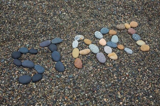 Start made from stones on sandy beach