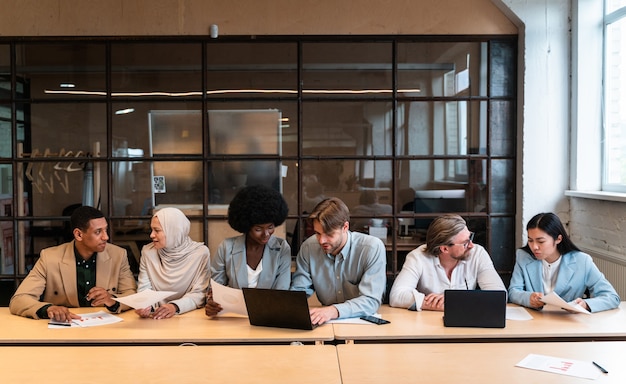 Start up business team in the office. Multiethnic group working together on a new project in the conference room