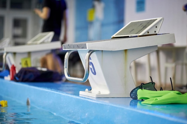 A starting block, number 5 of indoor swimming pool.Starting platform with number 5 for swimming race