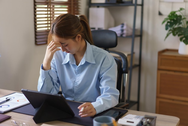 Startup business concept Businesswomen are stressed and exhausted from hard work in workplace