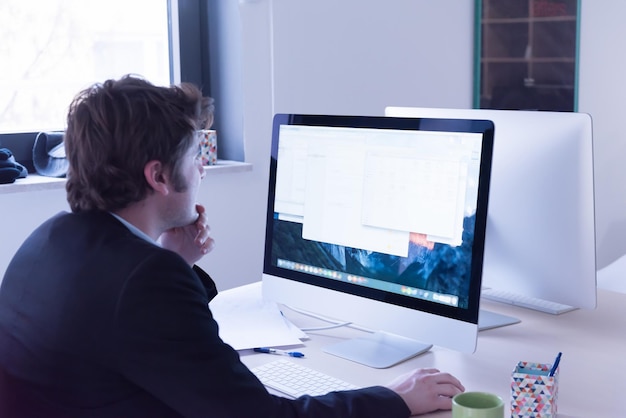 startup business, software developer working on computer at modern office