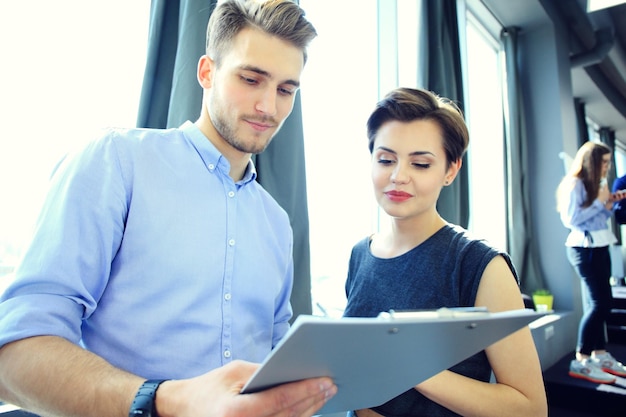 Startup diversity teamwork brainstorming meeting conceptbusiness team coworkers analyze finance report laptoppeople working start up processgroup young hipsters discussing office