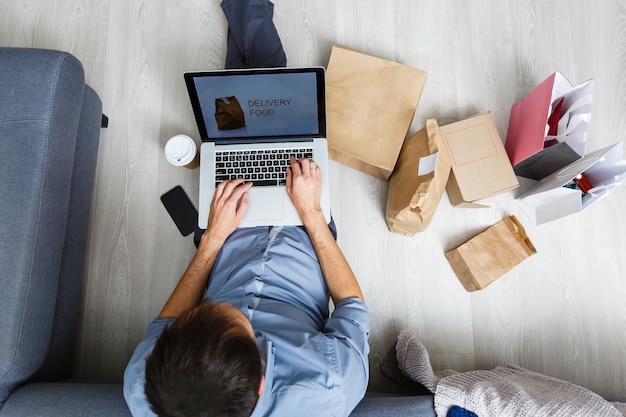 startup small business entrepreneur with laptop, a freelance man working a box, Young Asian business owner at home office, online marketing packaging box and delivery, technology SME delivery concept