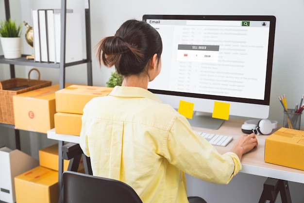 Startup small business,  young woman checking email on the computer