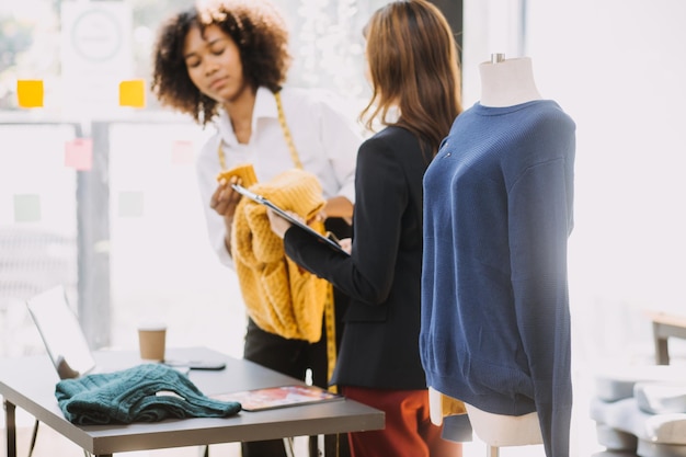 Startup SME small business entrepreneur of freelance Asian woman wearing apron using laptop and box to receive and review orders online to prepare to pack sell to customers online sme business ideas