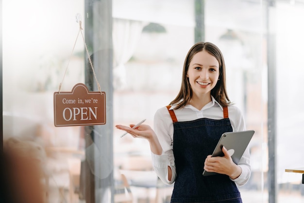 Startup successful small business owner sme woman stand with tablet in cafe restaurant xA