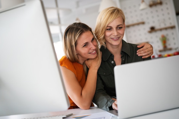 Startup young business partners women working together in office