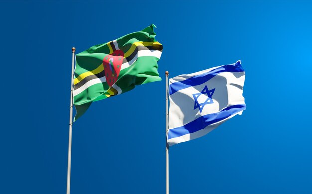 Flag di stato di israele e dominica insieme sullo sfondo del cielo