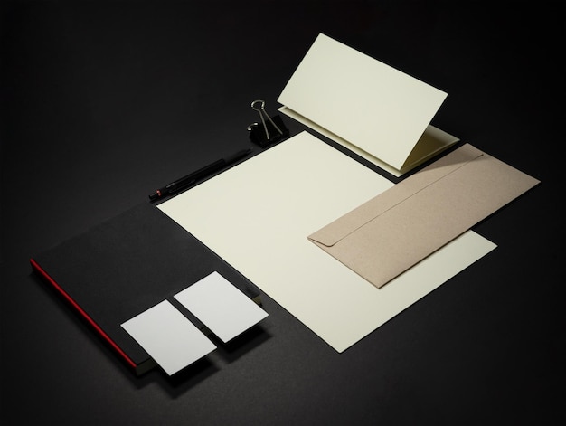 Stationery branding mockup template with dark surface by real photography