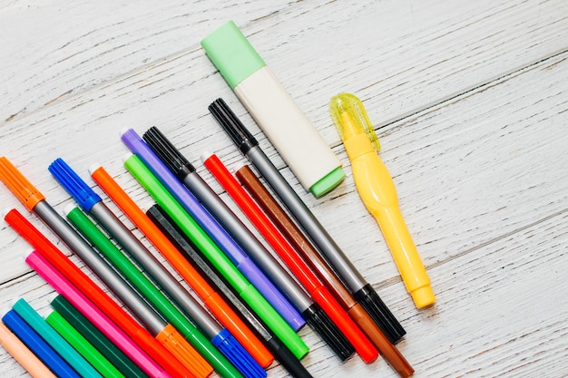 Stationery colored felttip pens on a white table