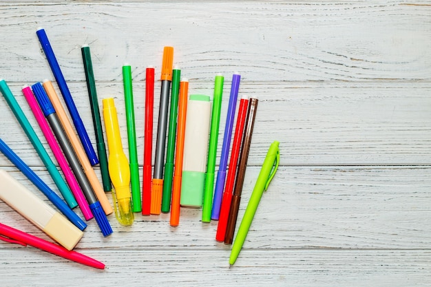Stationery colored felttip pens on a white table