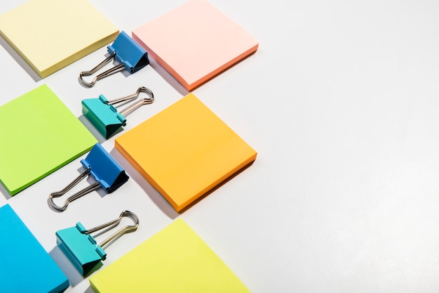 Stationery concept with sticky notes and binder clips