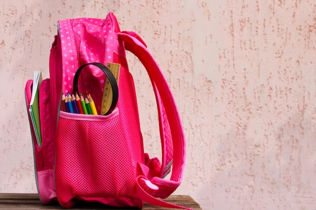 Stationery objects. School supplies are in school backpack. 