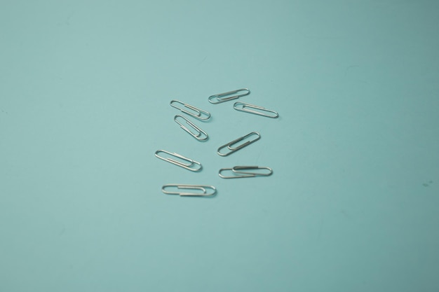 Stationery paper clips on background