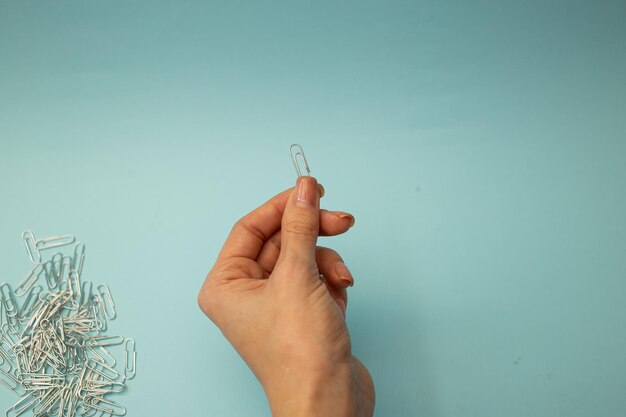 stationery paper clips on background