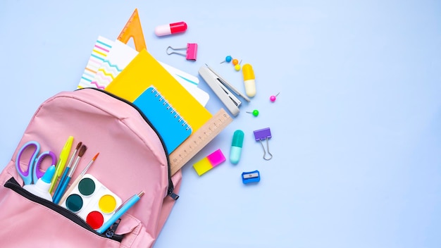 Stationery spilling out of a backpack