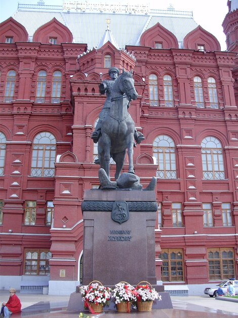 Statue against building in city