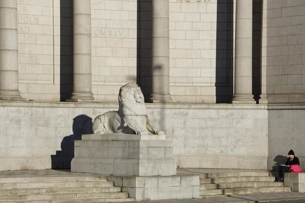 Statue against building