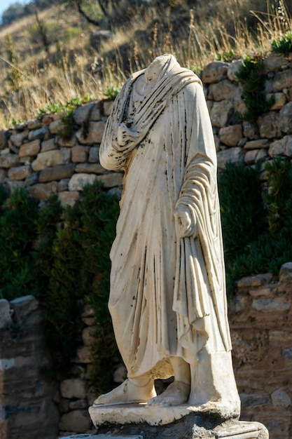 Statue against stone wall