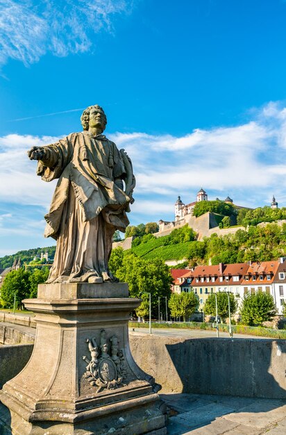 Statue on the Alte Mainbrucke and Marienberg Fortress in Wurzburg Bavaria Germany