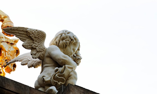 A statue of a angel on top of a building