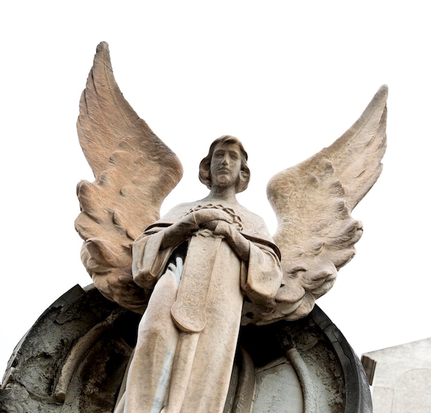 A statue of an angel with wings on top of a building.