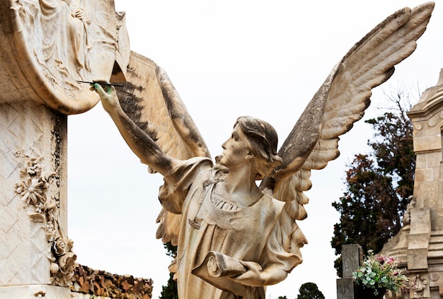 A statue of an angel with the word angel on it