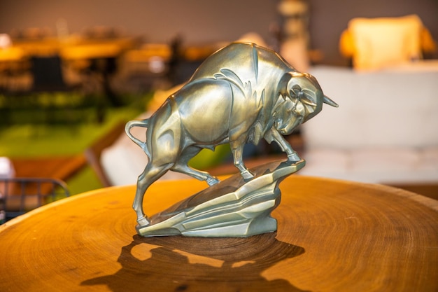 A statue of a bull on a table