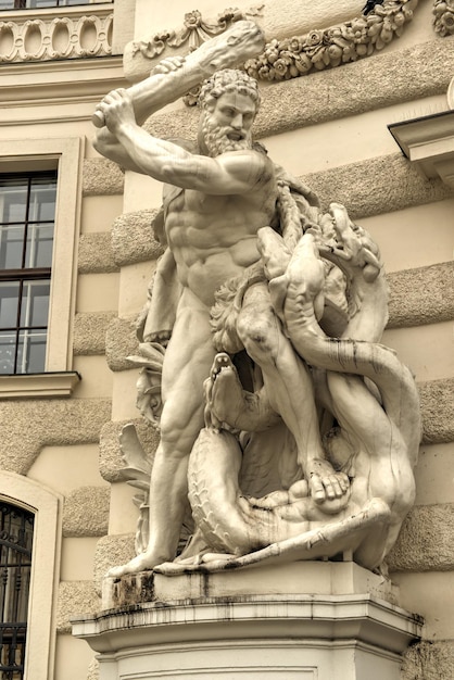 Statue of Hercules outside the Hofburg Palace in Vienna Austria showing how he fulfills the legendary Labors of Hercules