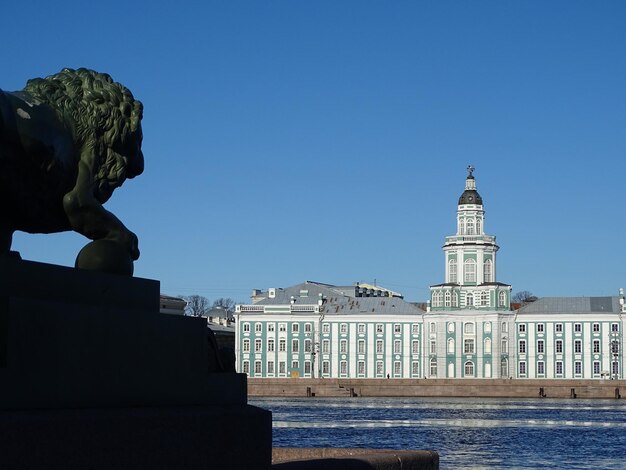 Statue of historic building against clear blue sky