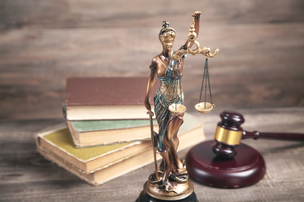 Statue of Lady Justice, book and gavel.