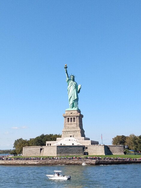 Statue of liberty against clear blue sky